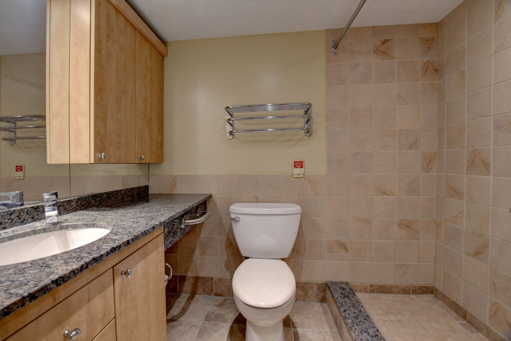 Private Bathroom With Shower Heads And Sink